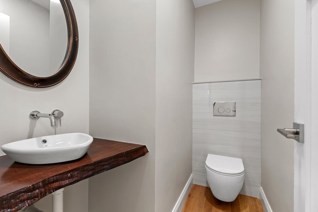 17 Emerson Street Stoneham, MA 02180 - Photo 19 of 41 a bathroom with a sink and a mirror