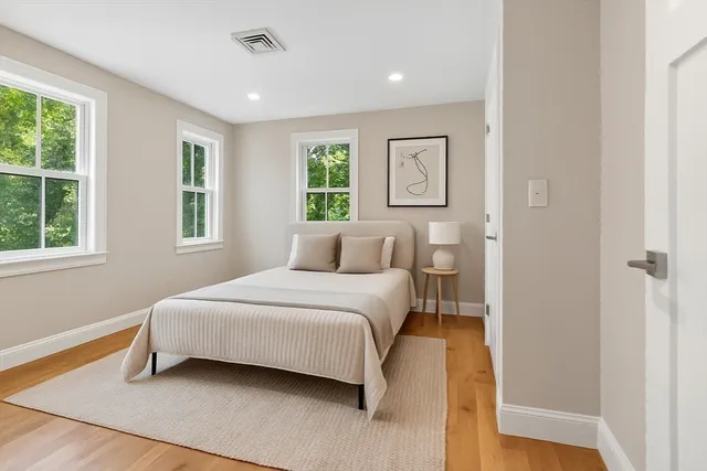 a bedroom with a bed and window