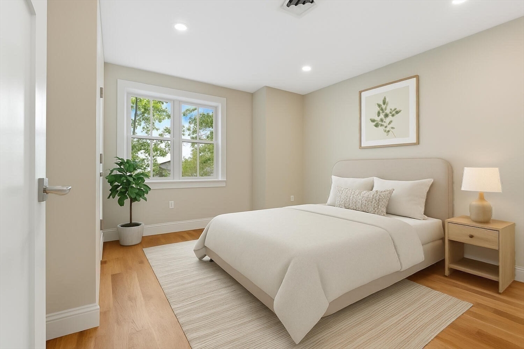 17 Emerson Street Stoneham, MA 02180 - Photo 25 of 41 a bedroom with a large bed and a window