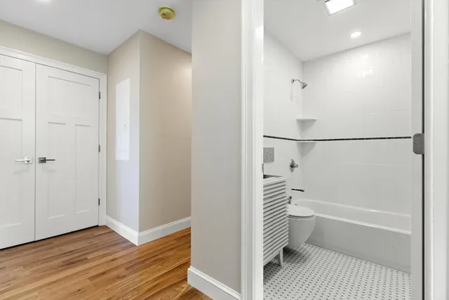 a bathroom with a bathtub and a shower