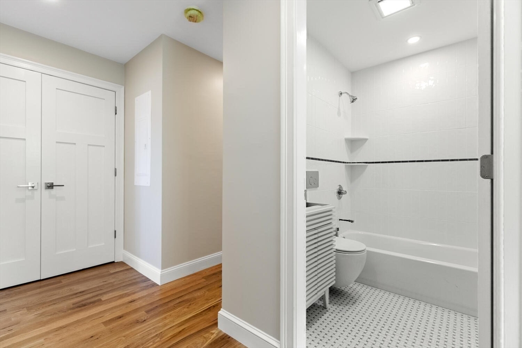 17 Emerson Street Stoneham, MA 02180 - Photo 30 of 41 a bathroom with a bathtub and a shower