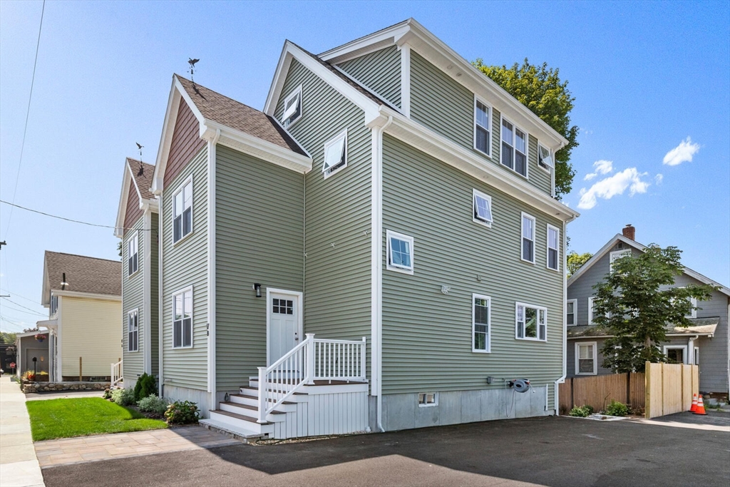 17 Emerson Street Stoneham, MA 02180 - Photo 41 of 41 a front view of a house with a yard