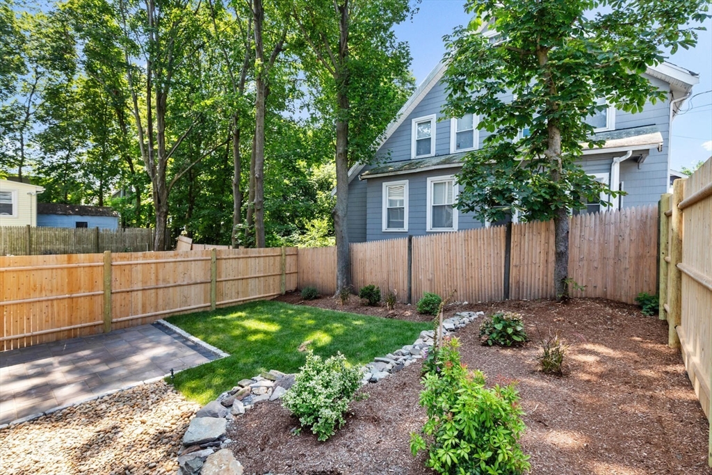 17 Emerson Street Stoneham, MA 02180 - Photo 5 of 41 a front view of a house with a garden