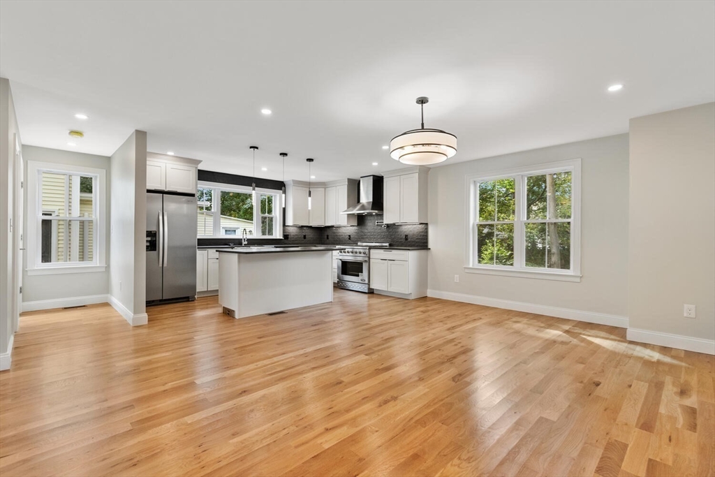 17 Emerson Street Stoneham, MA 02180 - Photo 8 of 41 a view of a kitchen with a sink and a stove top oven