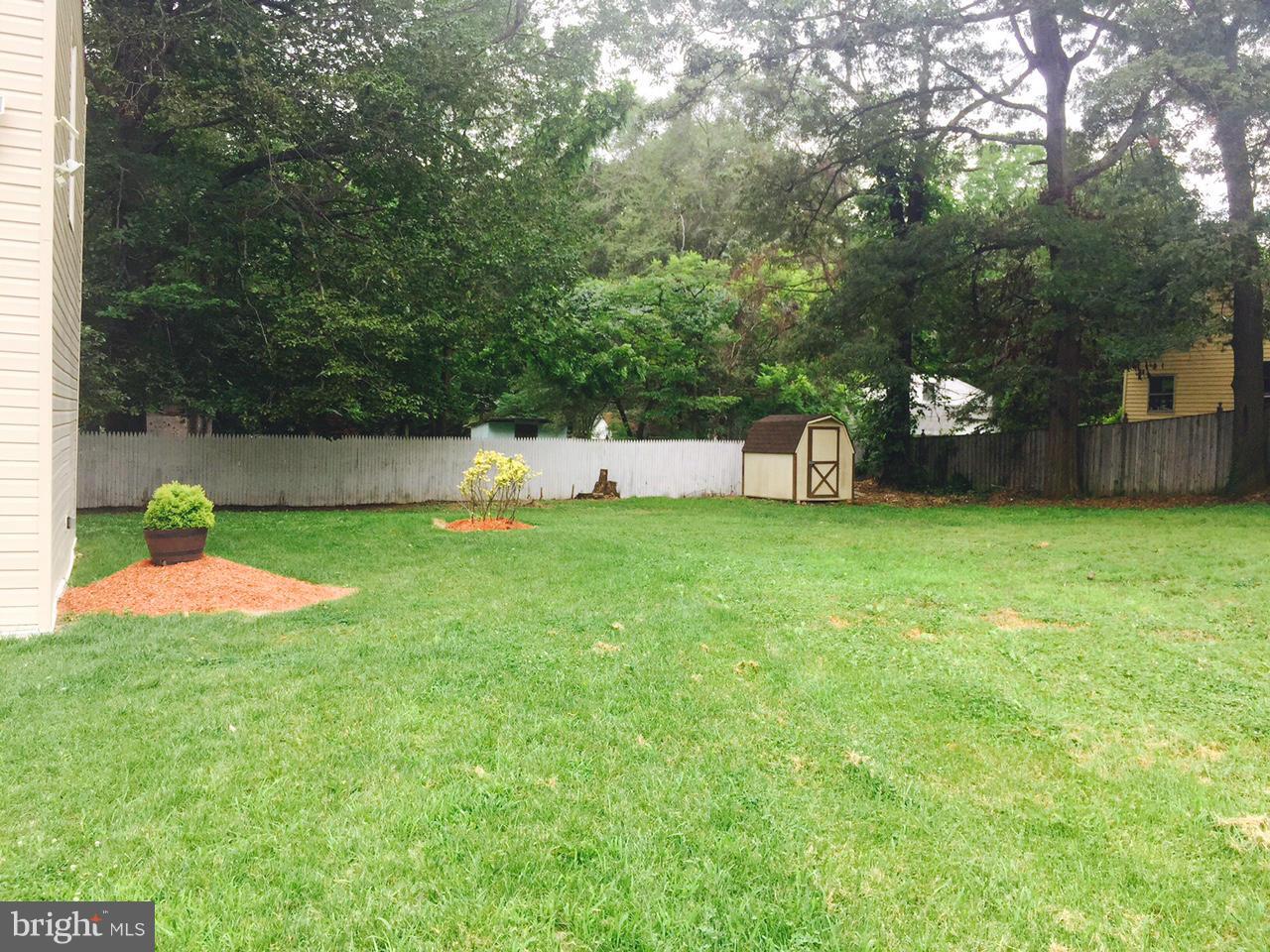 8201 Allentown Road Fort Washington, MD 20744 - Photo 22 of 24 a view of a house with a yard and sitting area
