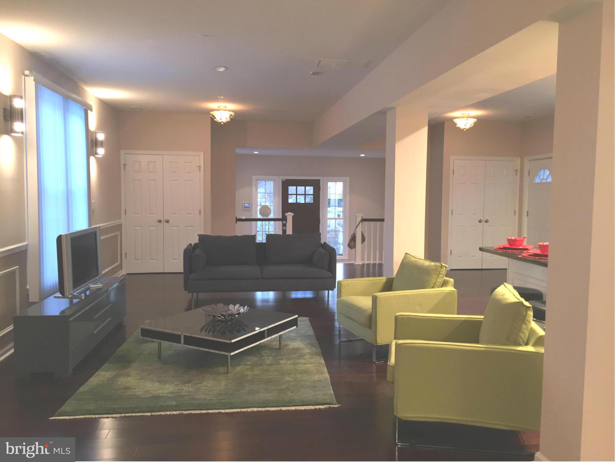 8201 Allentown Road Fort Washington, MD 20744 - Photo 5 of 24 a living room with furniture and a flat screen tv