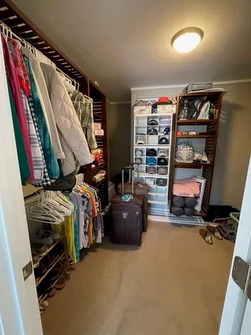 a view of gallery with wooden floor