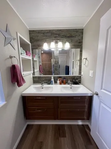 a bathroom with a glass shower door