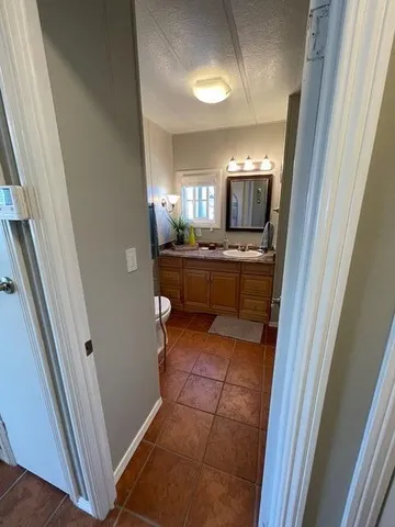 a dining room with furniture and a chandelier