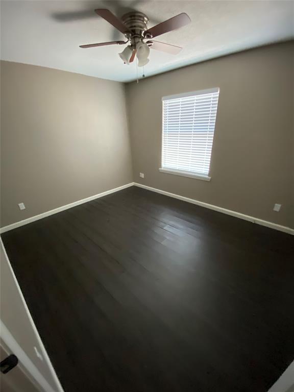 141 West Canton Street, Unit F Palmer, TX 75152 - Photo 1 of 14 a view of an empty room with wooden floor and a window