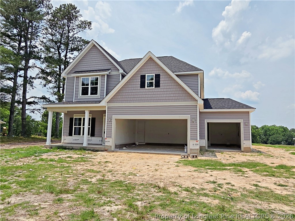 2678 Norrington Road Lillington, NC 27546 - Photo 1 of 31 a front view of a house with a yard and garage