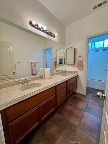 a white toilet sitting next to a window