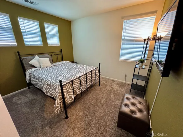 a room with closet and wooden floor
