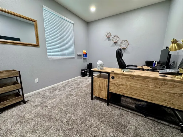 a living room with a flat screen tv and washer