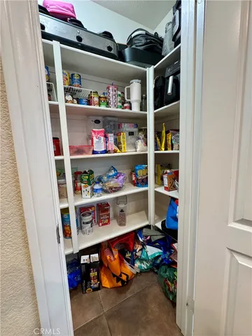 a kitchen with cabinets and window