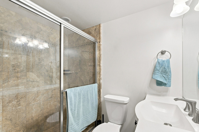 11882 Pond Ridge Drive Draper, UT 84020 - Photo 36 of 49 Shower with glass enclosure and full-height tile surround