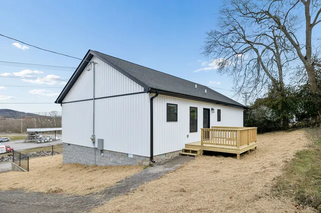 a view of a house with a snow in the yard