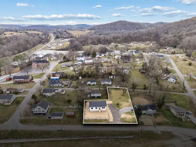 an aerial view of residential houses with parking