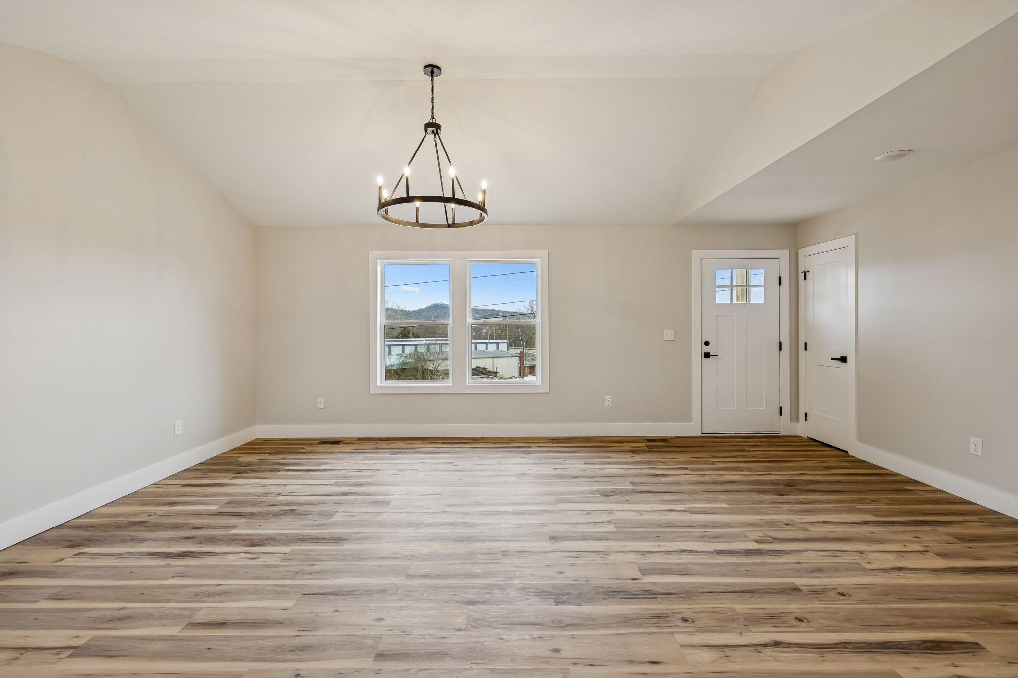 108 Read Avenue Carthage, TN 37030 - Photo 4 of 21 a view of an empty room with window and wooden floor