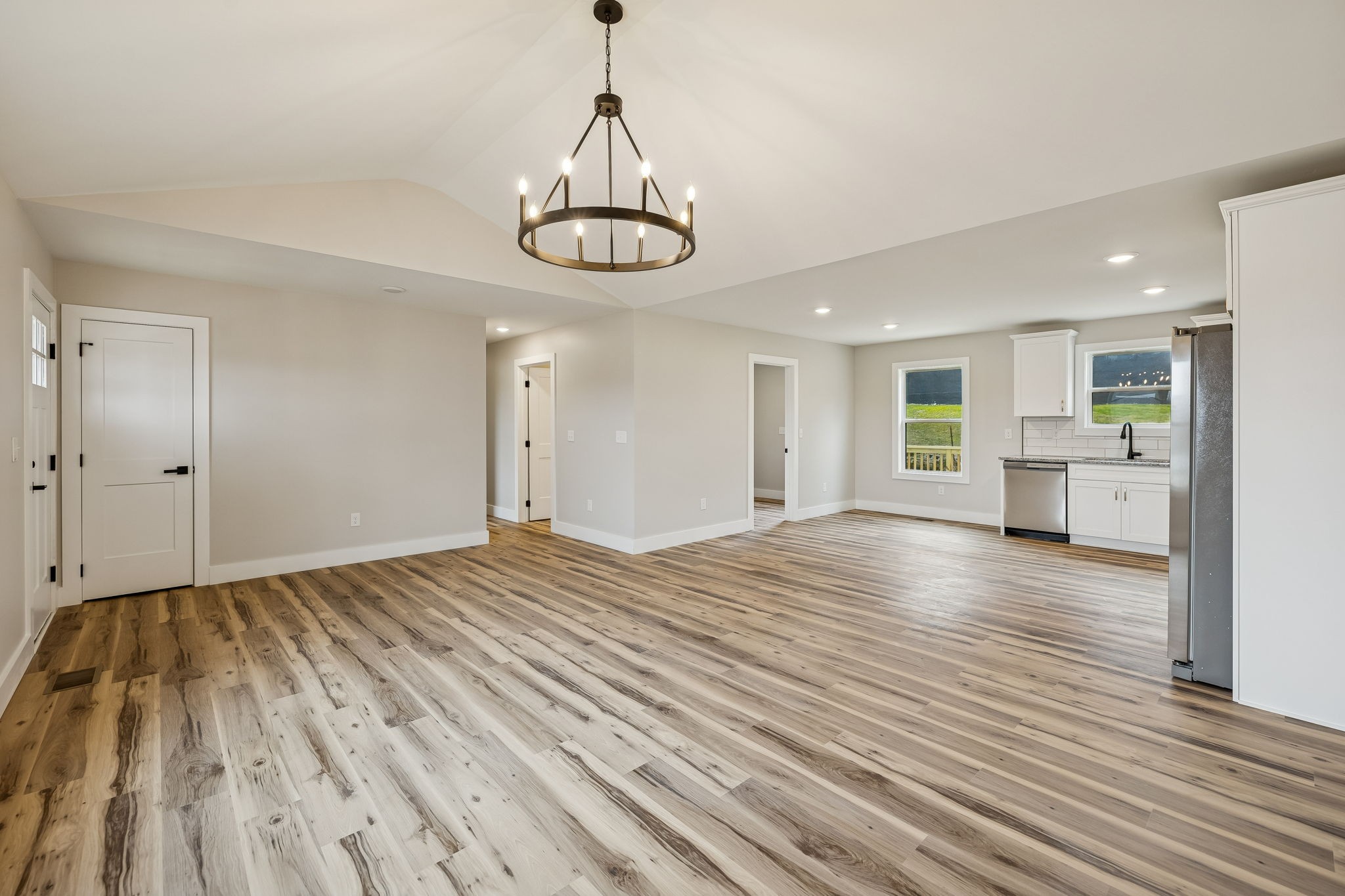 108 Read Avenue Carthage, TN 37030 - Photo 5 of 21 a view of empty room with wooden floor and kitchen