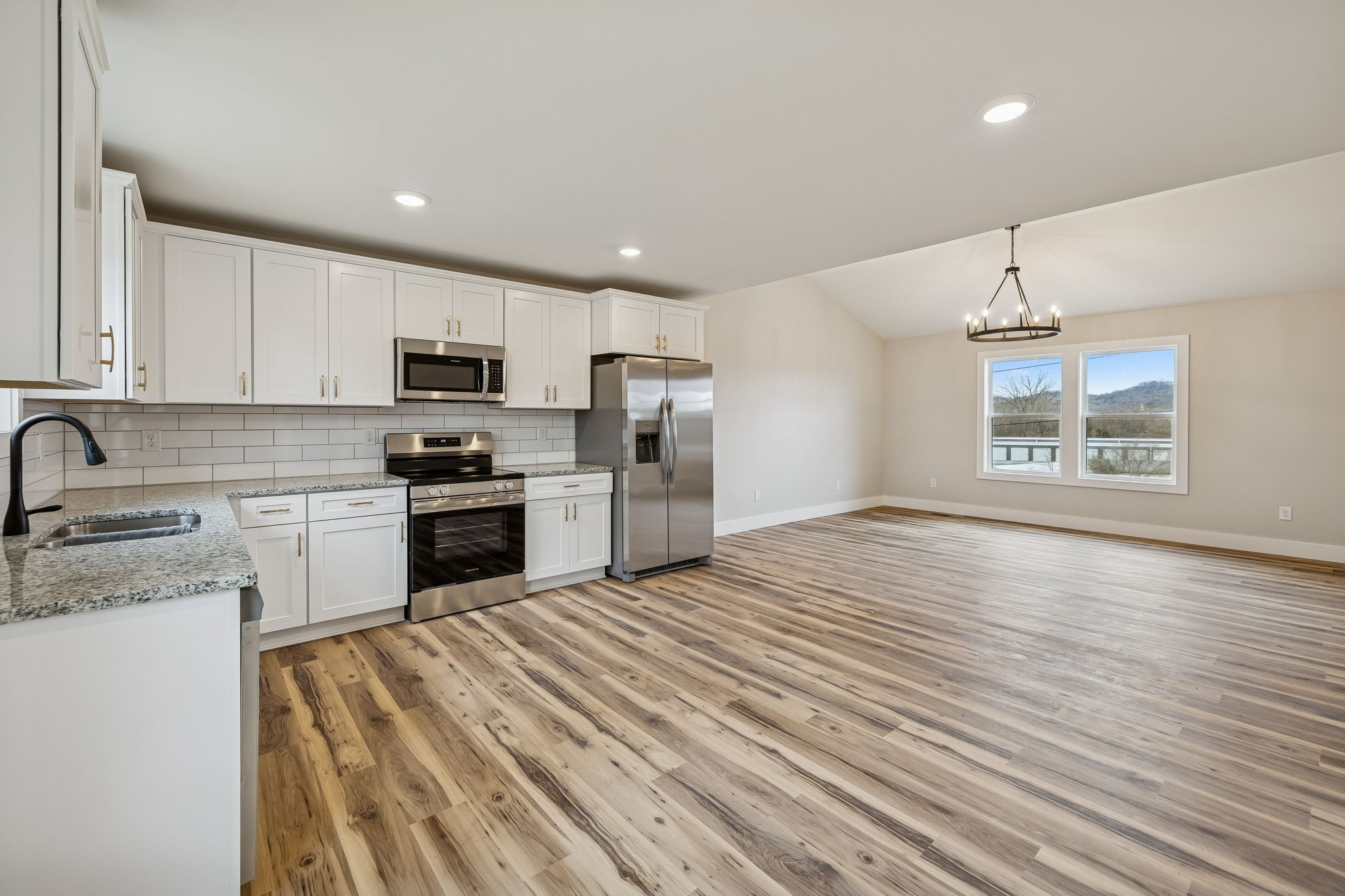 108 Read Avenue Carthage, TN 37030 - Photo 7 of 21 a kitchen with granite countertop a refrigerator stove top oven and sink