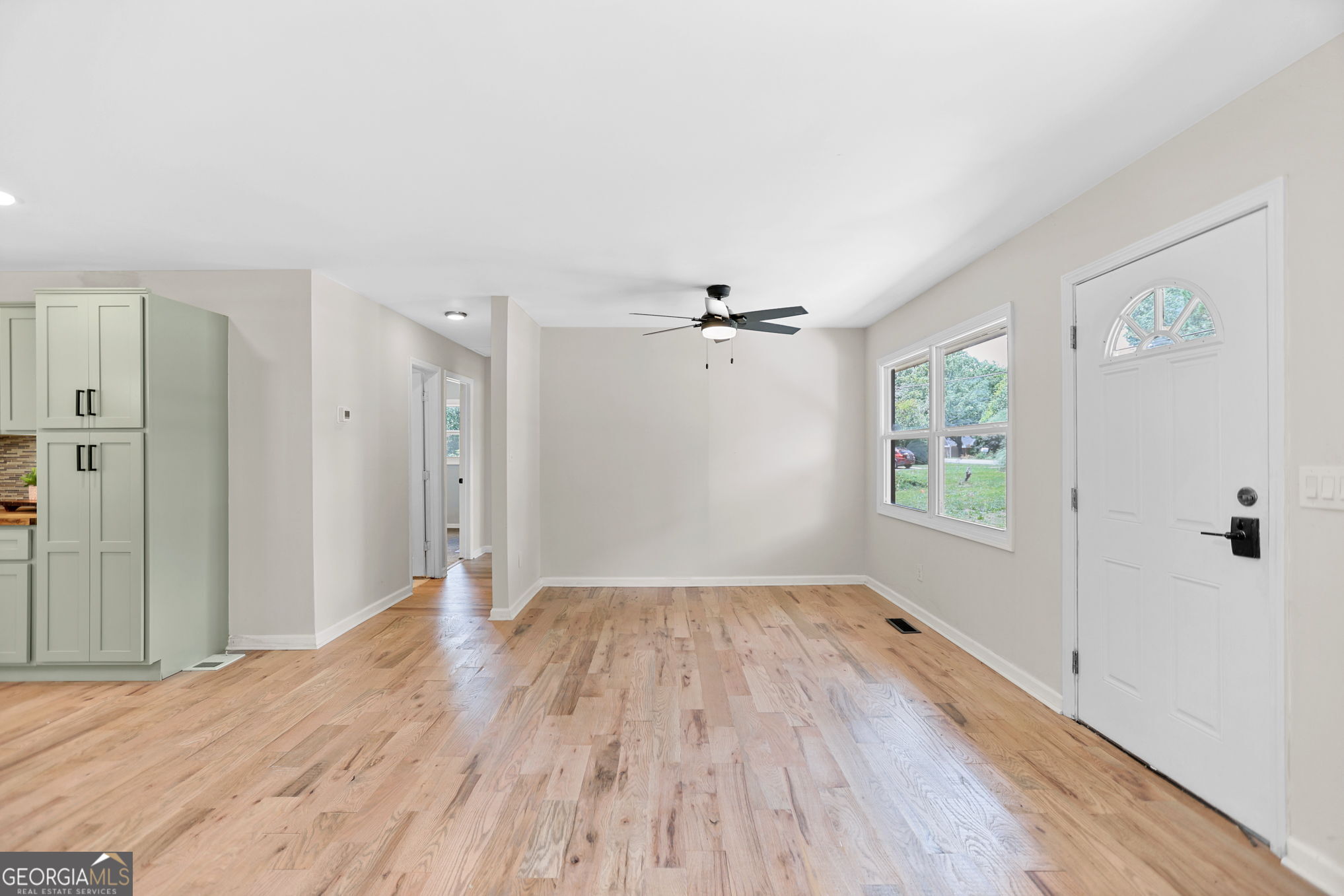 7060 Scenic Heights Road Manchester, GA 31816 - Photo 12 of 52 wooden floor in an empty room with a window