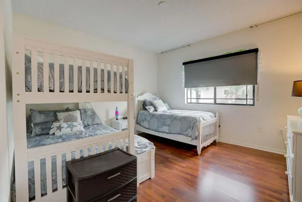 a kitchen with stainless steel appliances granite countertop a refrigerator and a stove