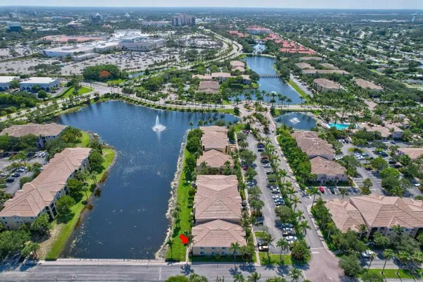 a view of a lake with houses in the background