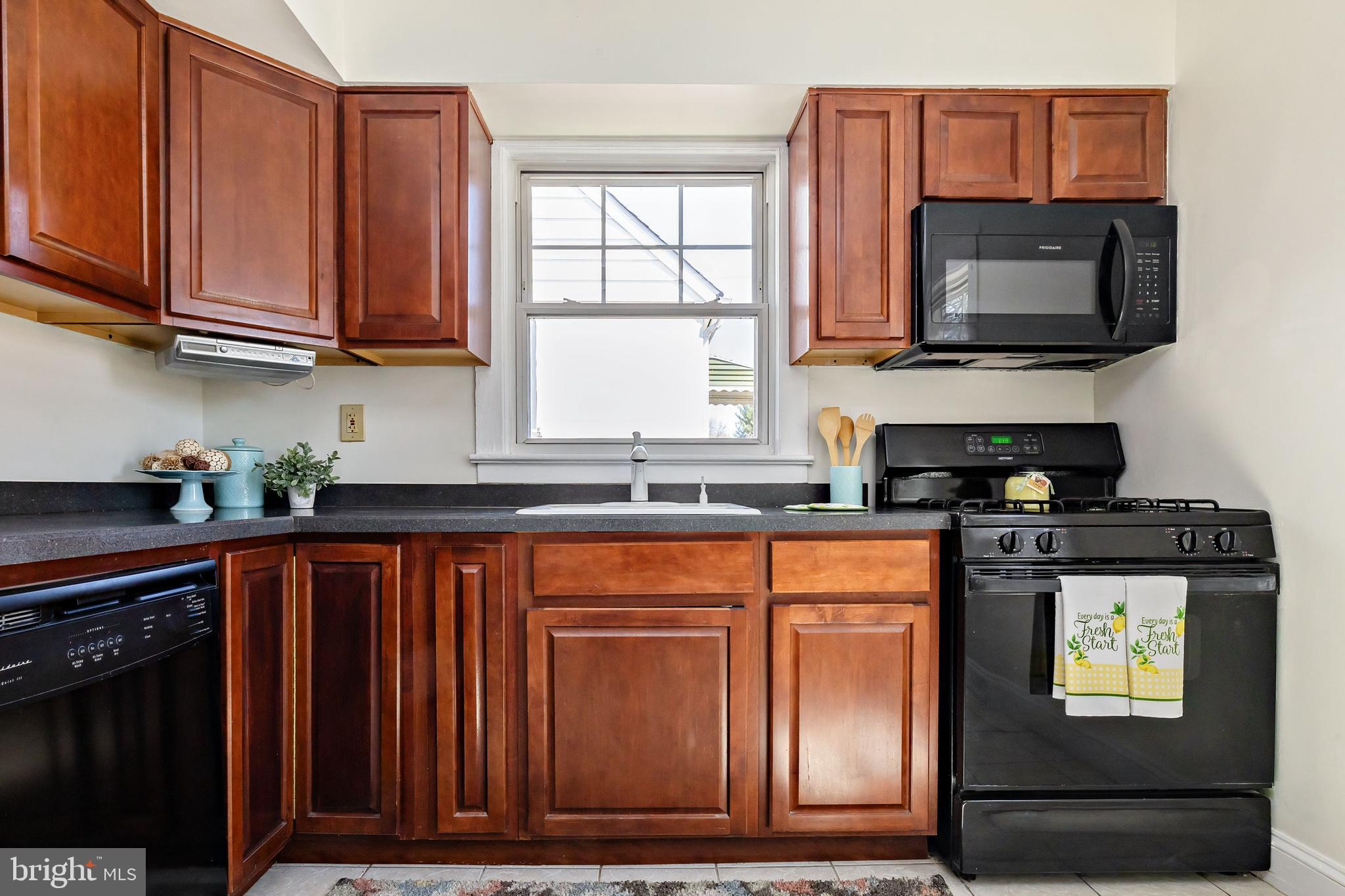 1944 Narberth Avenue Haddon Heights, NJ 08035 - Photo 18 of 61 a kitchen with stainless steel appliances granite countertop a stove a microwave and a sink