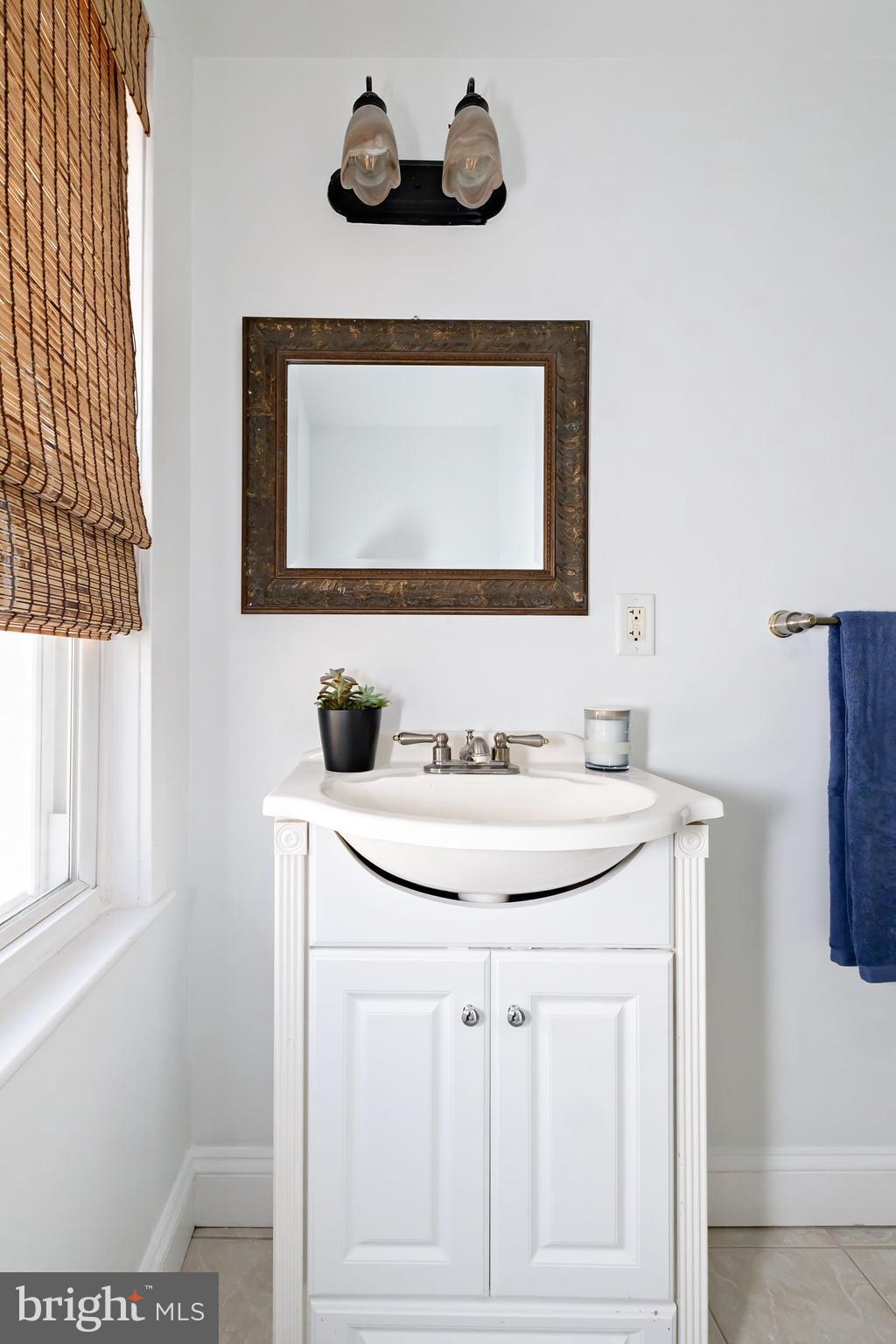 1944 Narberth Avenue Haddon Heights, NJ 08035 - Photo 22 of 61 a bathroom with a sink and a mirror