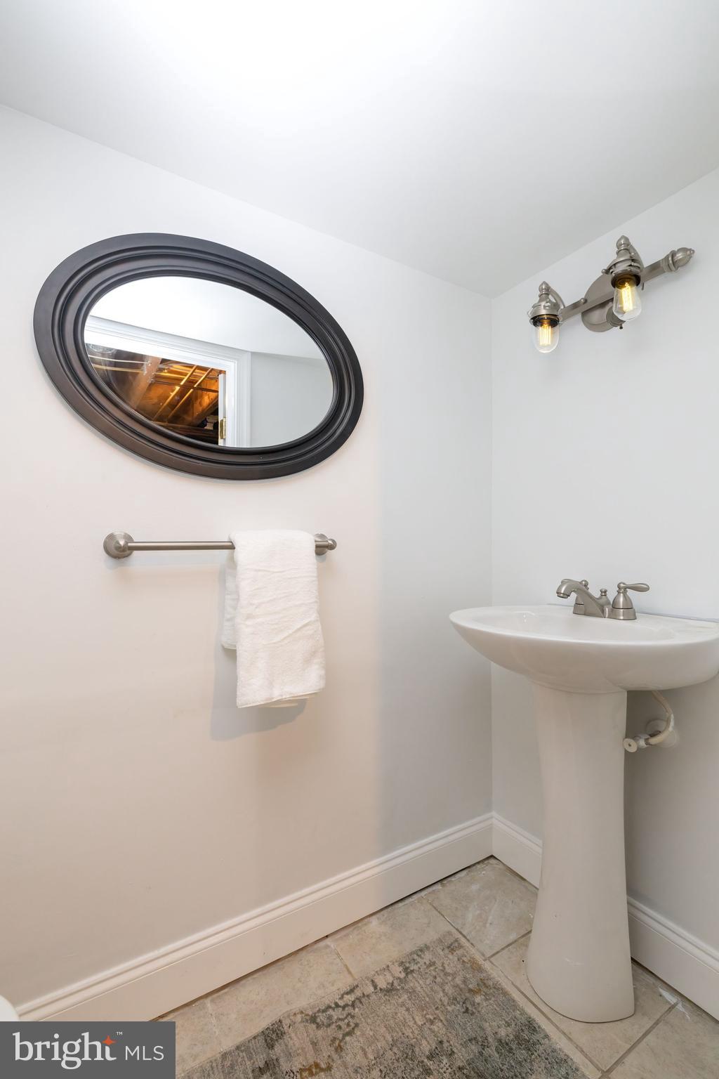 1944 Narberth Avenue Haddon Heights, NJ 08035 - Photo 46 of 61 a bathroom with a sink and a mirror