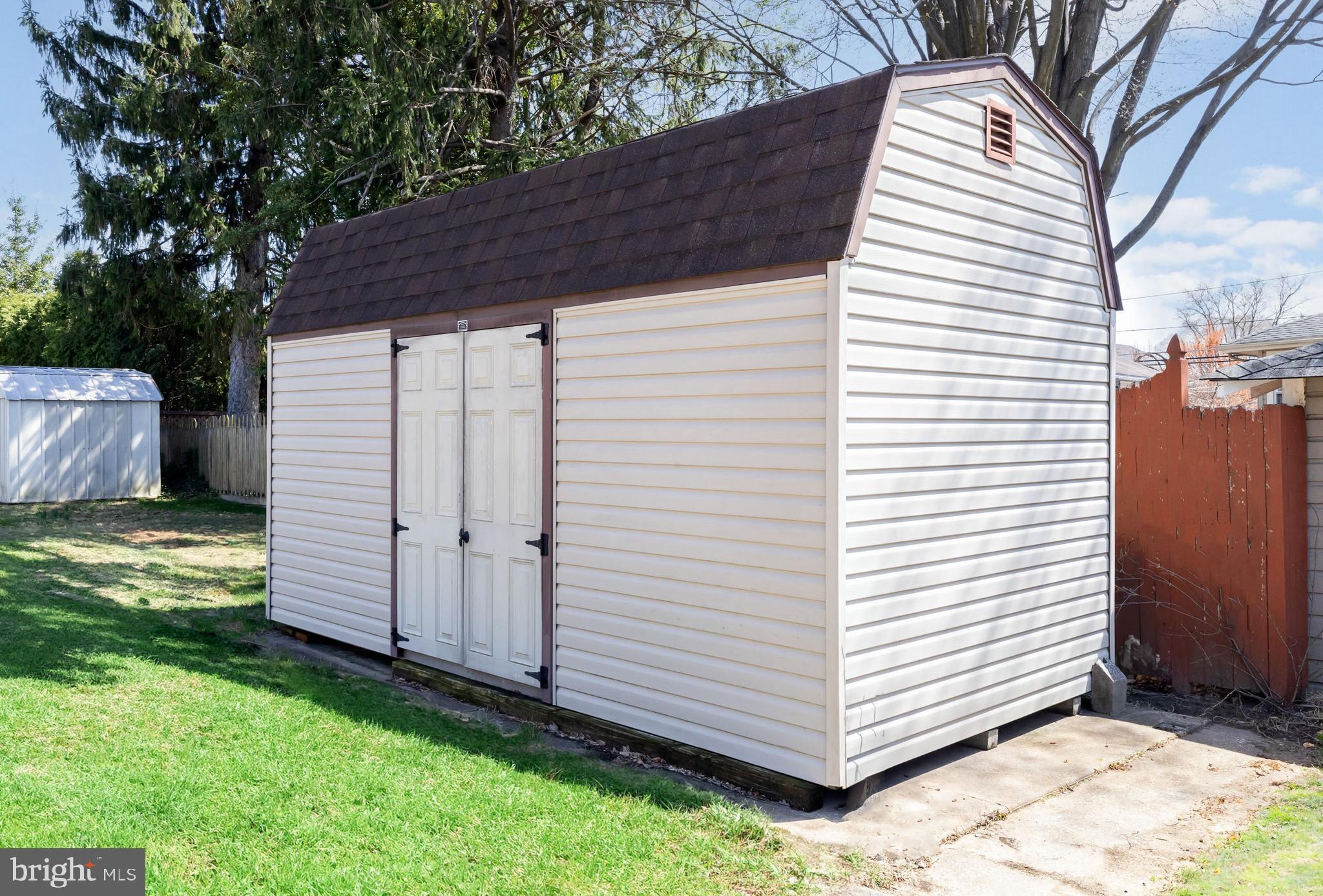 1944 Narberth Avenue Haddon Heights, NJ 08035 - Photo 49 of 61 a view of a small house with a white wooden fence and a large tree