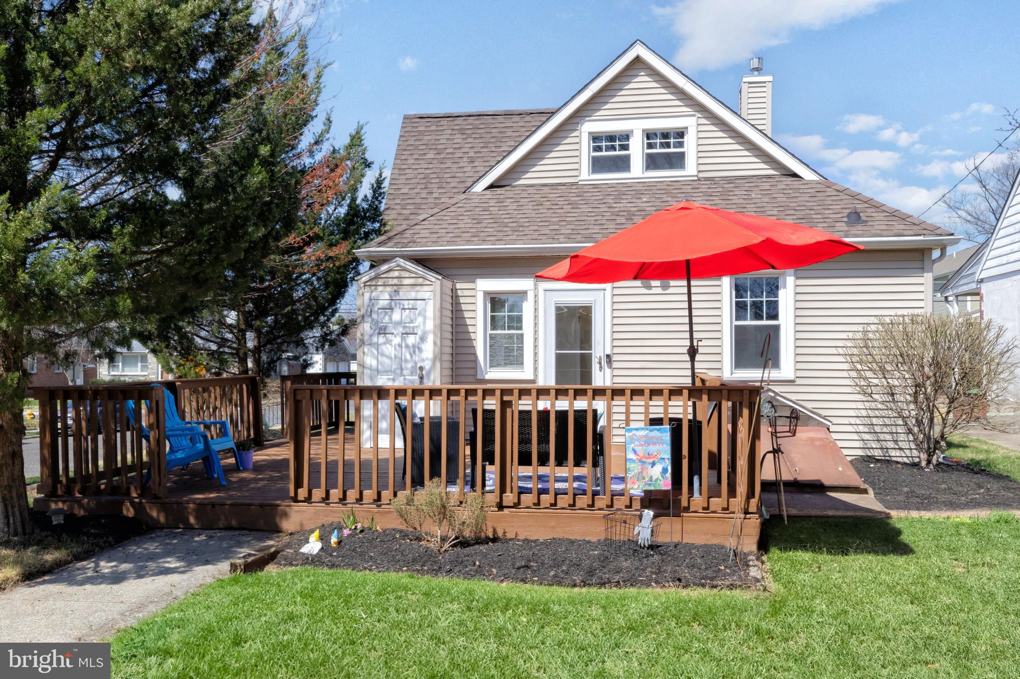 1944 Narberth Avenue Haddon Heights, NJ 08035 - Photo 8 of 61 a view of backyard with table and chairs under an umbrella