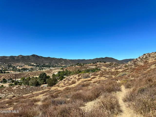 a view of a mountain range in a cloudy sky