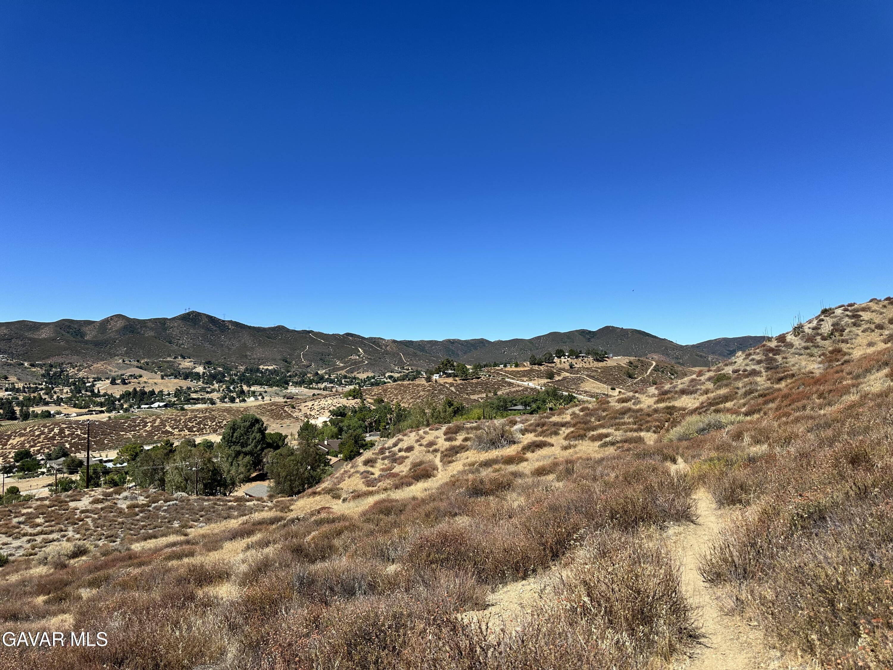 90th Street West Palmdale, CA 93551 - Photo 5 of 10 a view of a mountain range in a cloudy sky