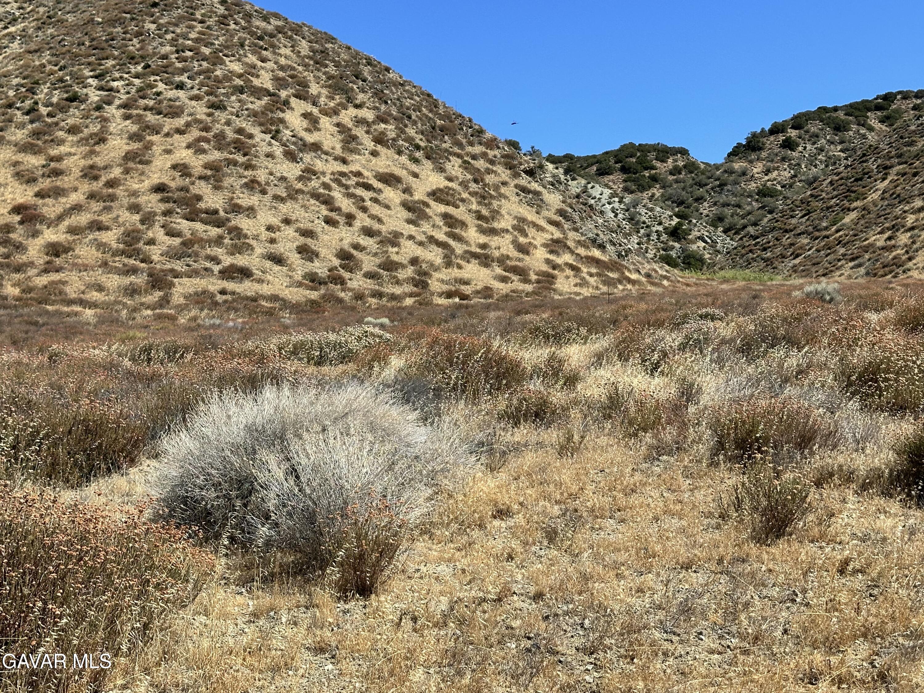 90th Street West Palmdale, CA 93551 - Photo 9 of 10 a view of a large building with mountains in the background