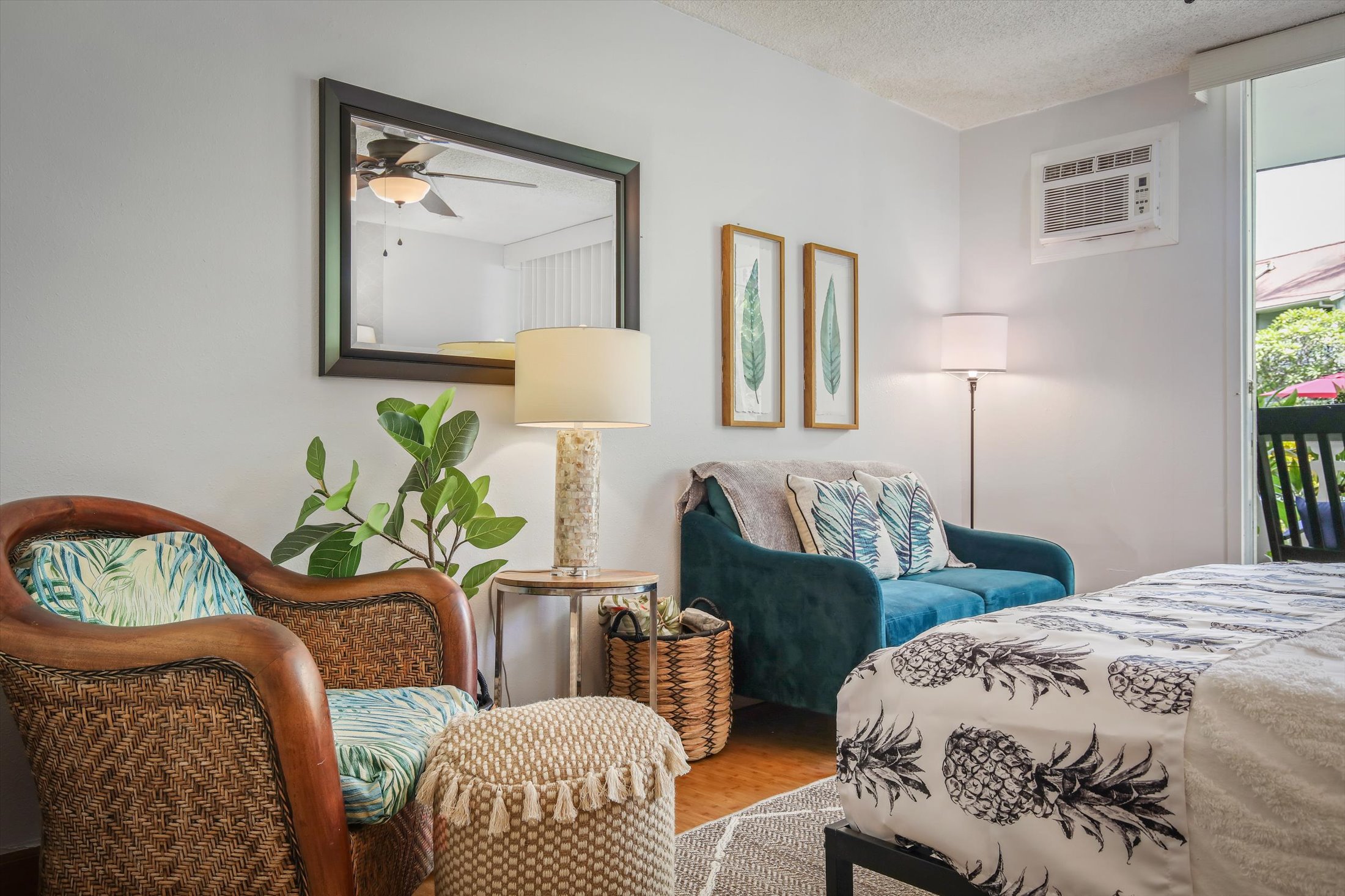 75-5776 Kuakini Highway, Unit 123 Kailua-Kona, HI 96740 - Photo 1 of 26 a bedroom with two beds and a table