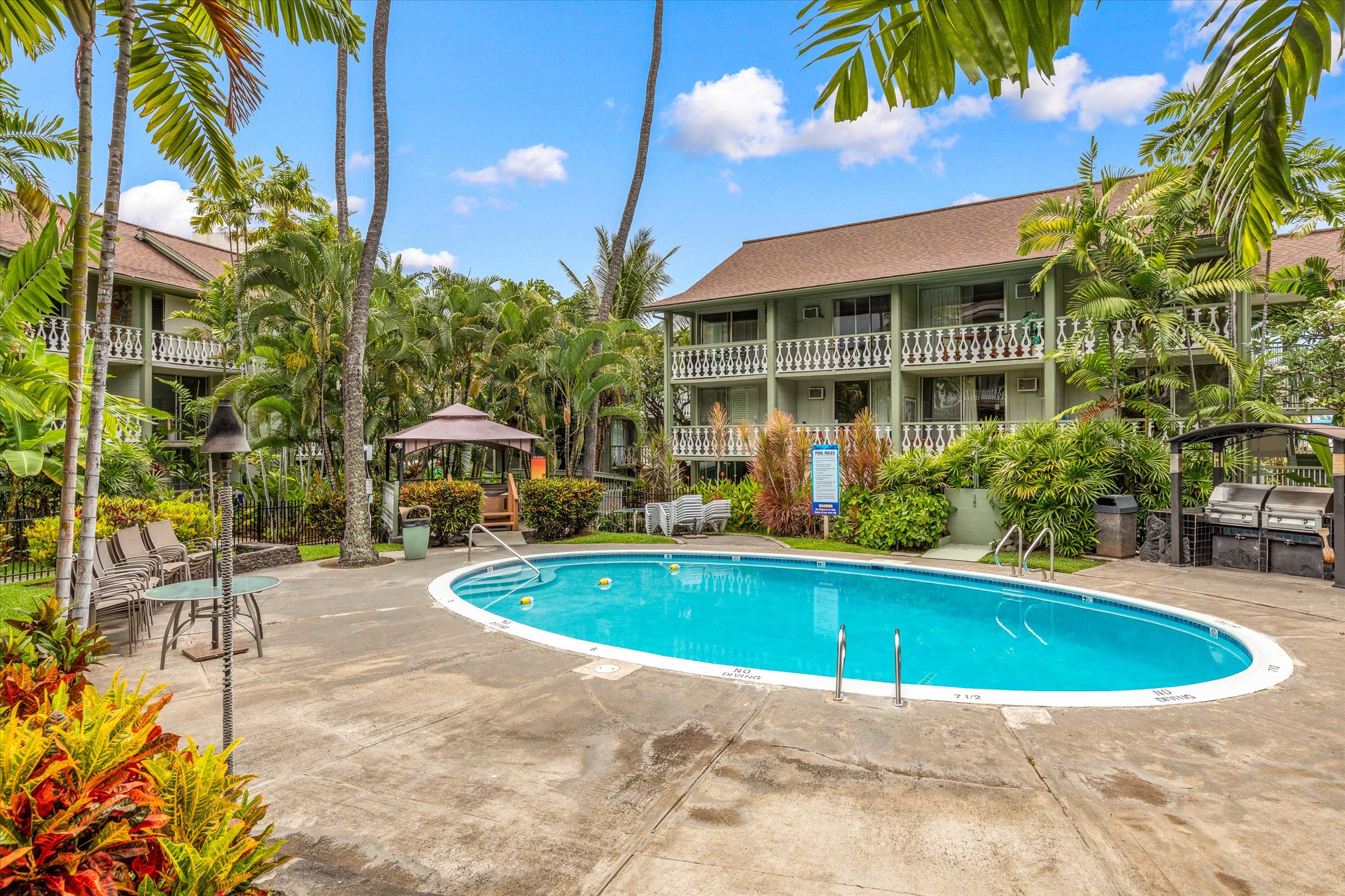75-5776 Kuakini Highway, Unit 123 Kailua-Kona, HI 96740 - Photo 19 of 26 a view of outdoor space yard swimming pool and furniture