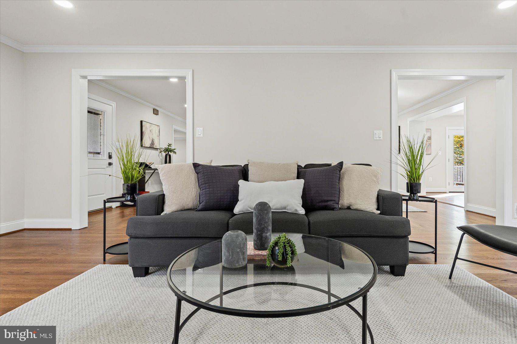 7604 Hackamore Drive Potomac, MD 20854 - Photo 13 of 81 a living room with furniture a rug and a dining table