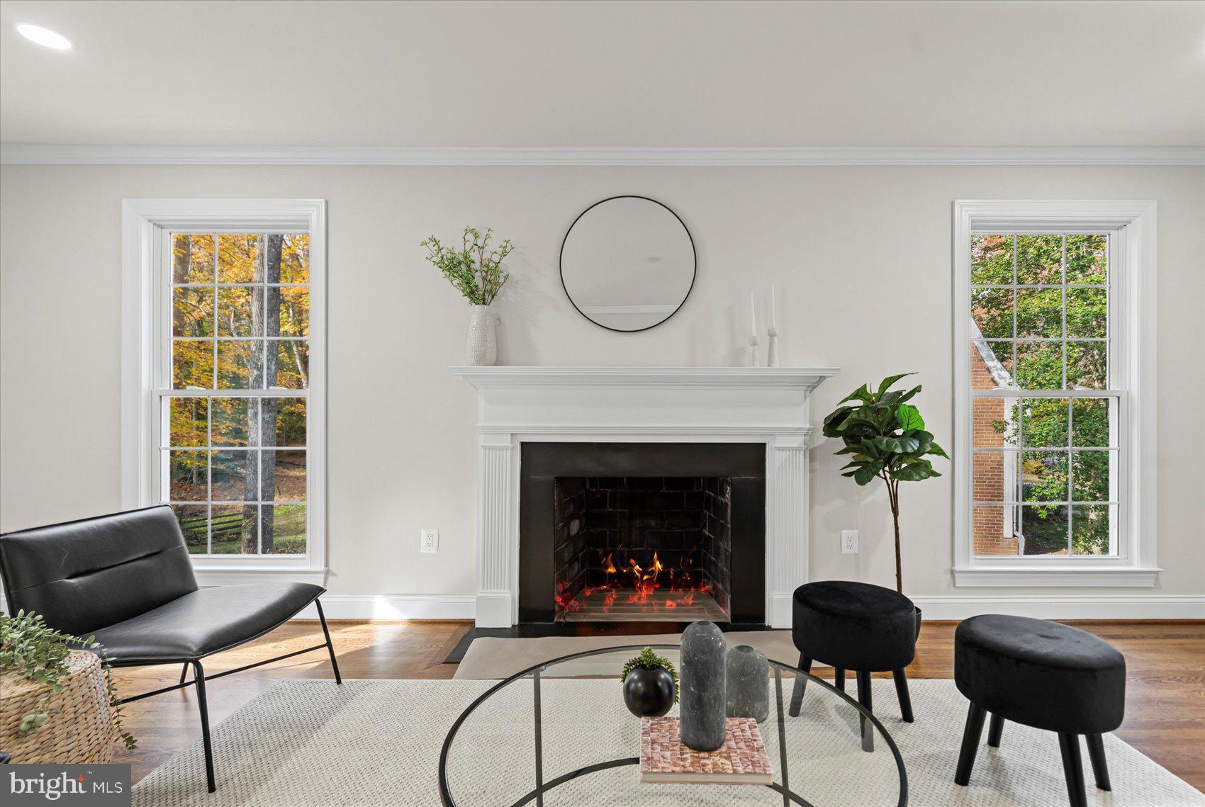7604 Hackamore Drive Potomac, MD 20854 - Photo 14 of 81 a living room with furniture and a fireplace