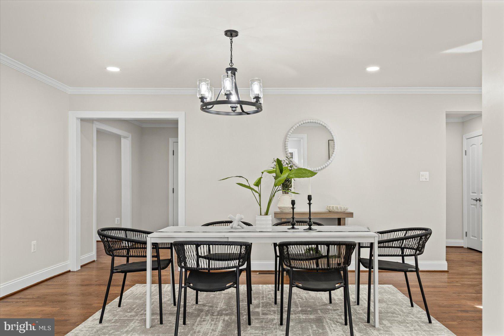 7604 Hackamore Drive Potomac, MD 20854 - Photo 23 of 81 a view of a dining room with furniture and chandelier