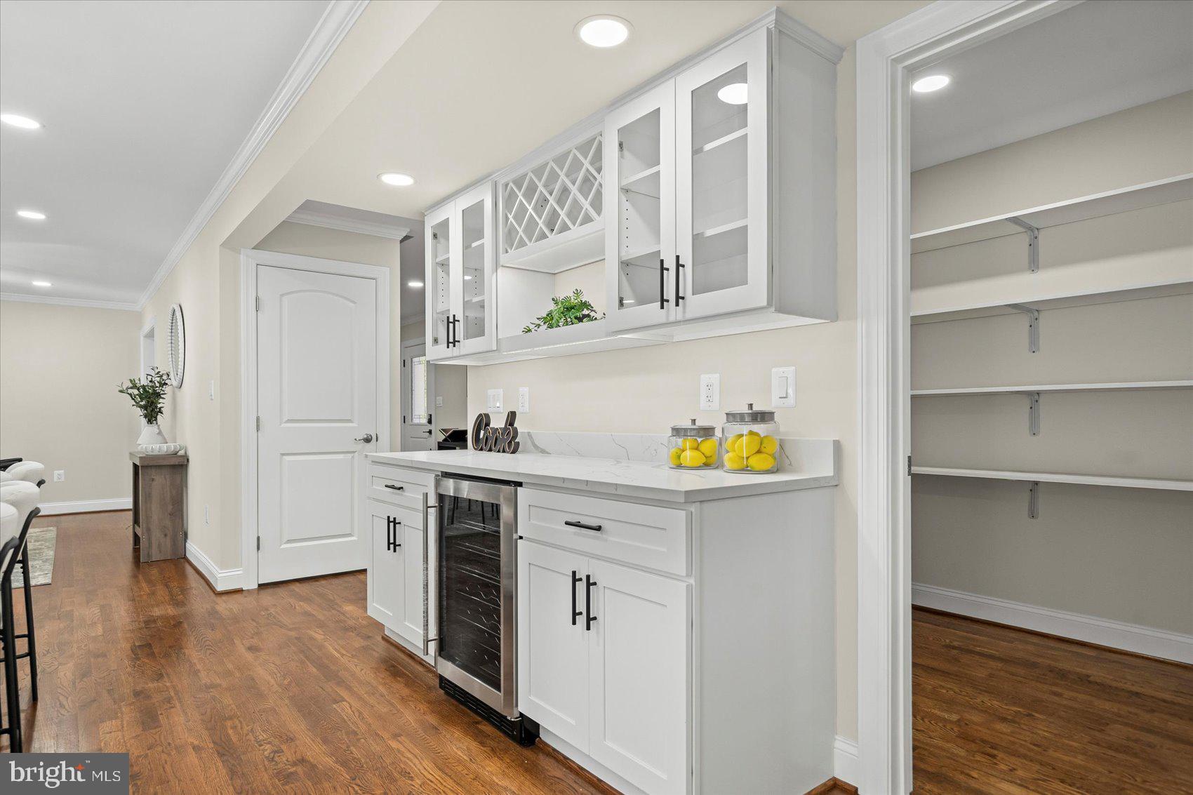 7604 Hackamore Drive Potomac, MD 20854 - Photo 28 of 81 a kitchen with stainless steel appliances a stove refrigerator and cabinets