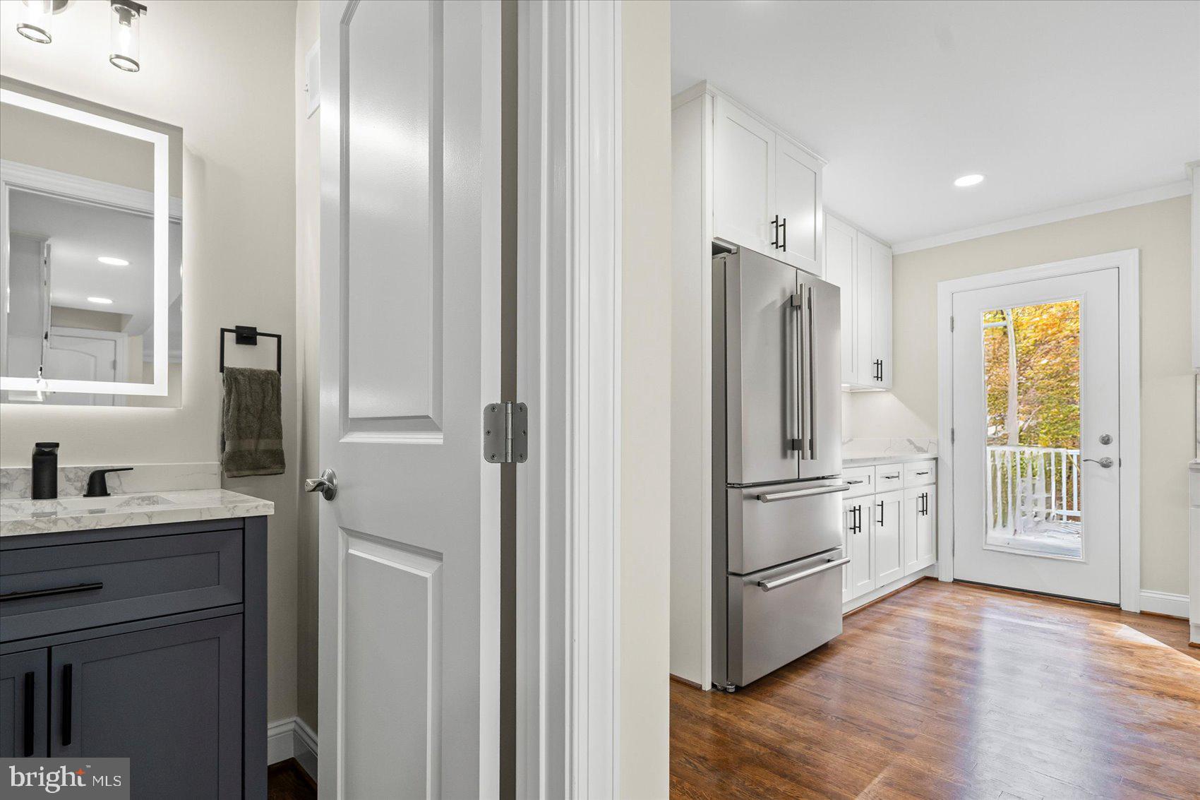 7604 Hackamore Drive Potomac, MD 20854 - Photo 32 of 81 a kitchen with a refrigerator sink and cabinets