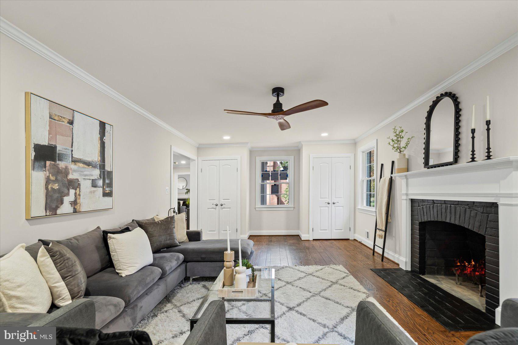 7604 Hackamore Drive Potomac, MD 20854 - Photo 33 of 81 a living room with furniture and a fireplace