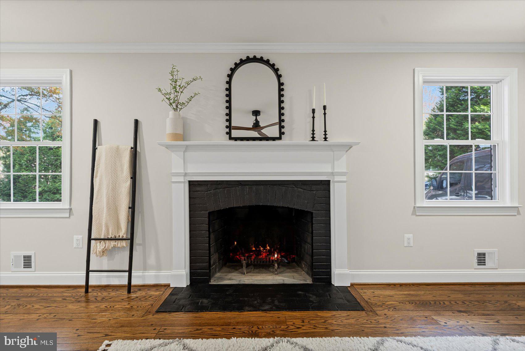 7604 Hackamore Drive Potomac, MD 20854 - Photo 36 of 81 a living room with a fireplace and a window