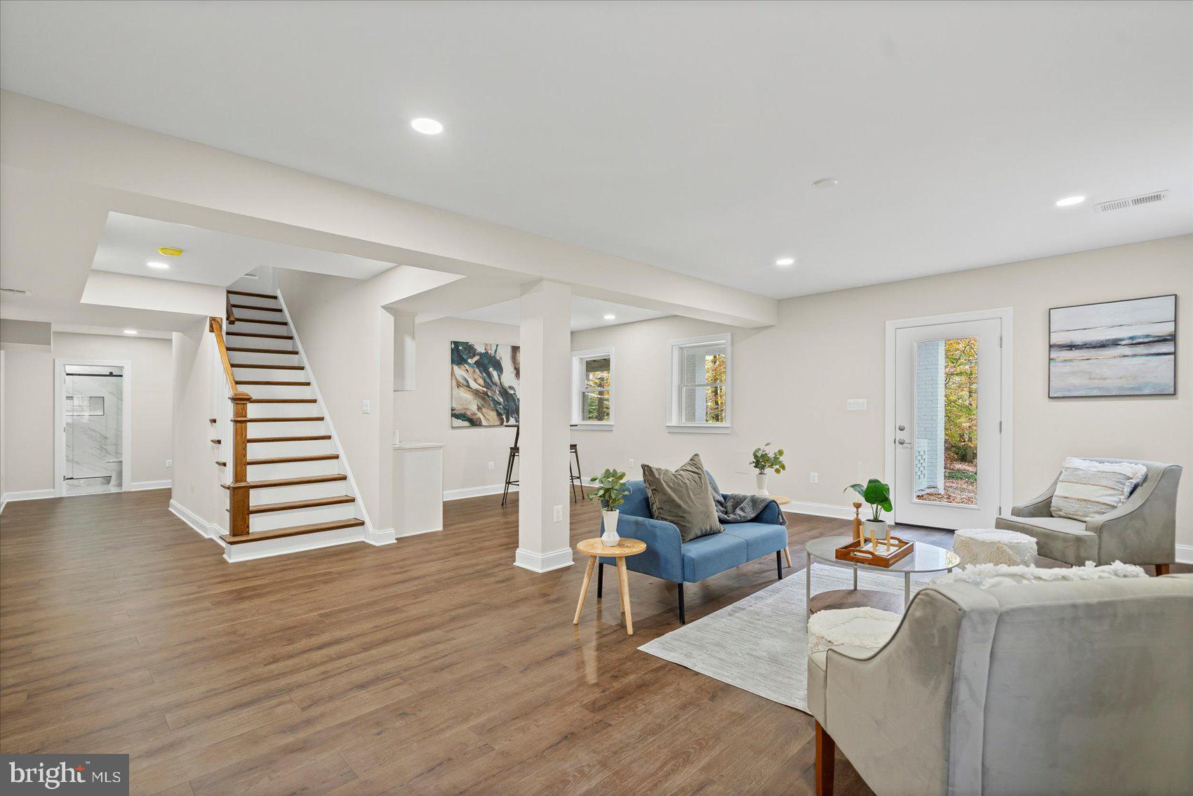 7604 Hackamore Drive Potomac, MD 20854 - Photo 37 of 81 a living room with furniture and wooden floor