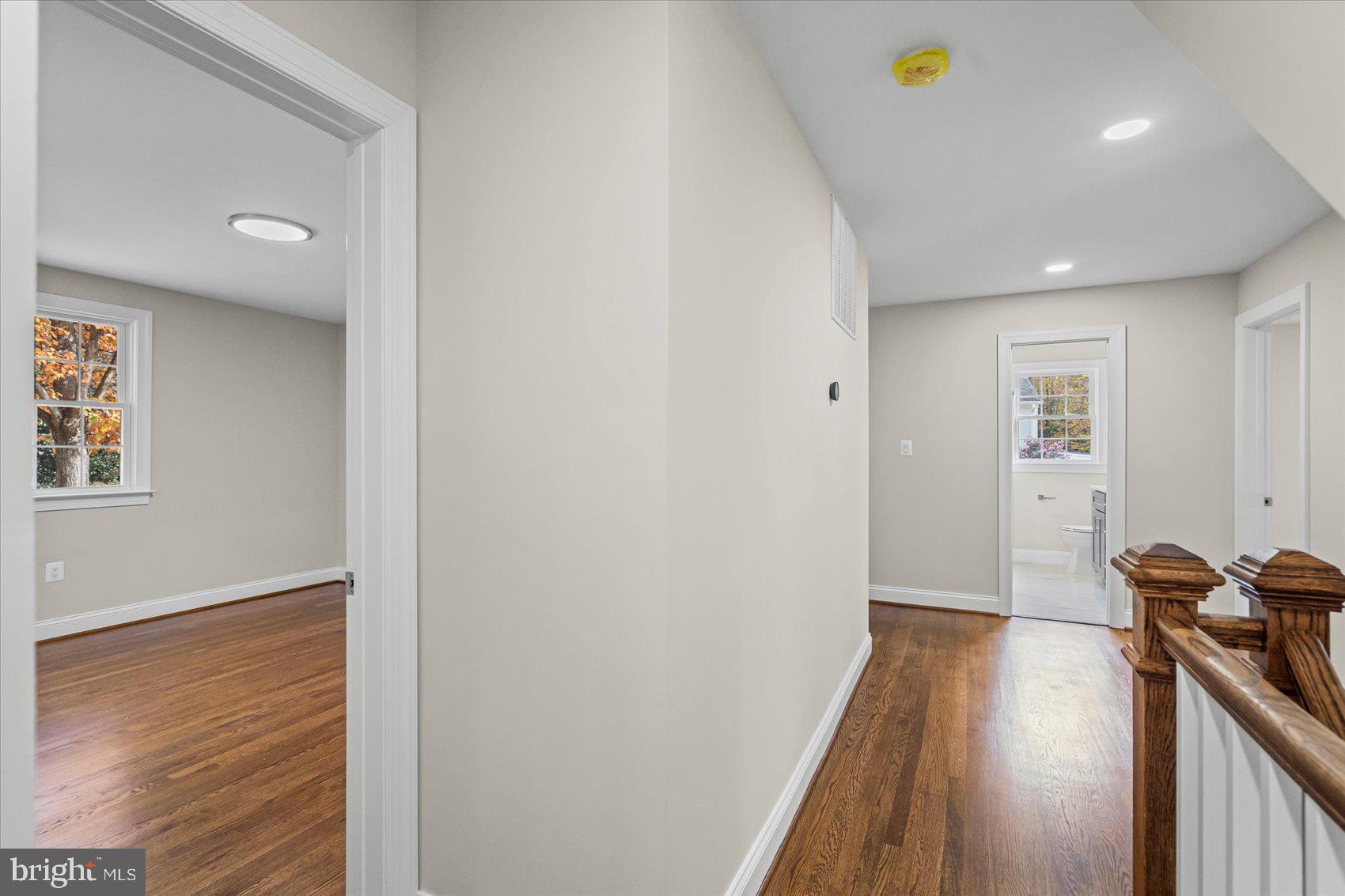 7604 Hackamore Drive Potomac, MD 20854 - Photo 51 of 81 a view of a hallway with wooden floor
