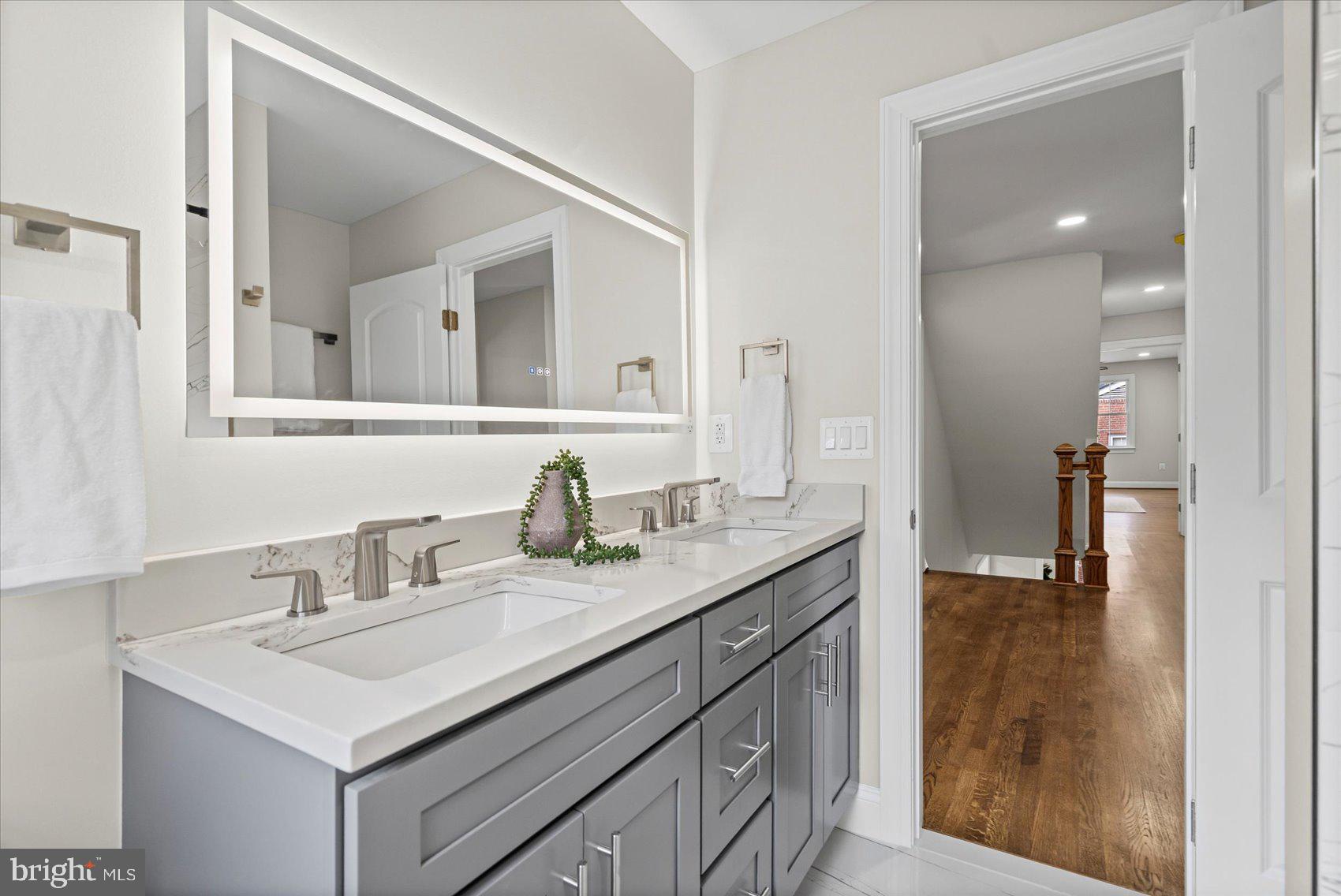 7604 Hackamore Drive Potomac, MD 20854 - Photo 60 of 81 a bathroom with a sink and a mirror
