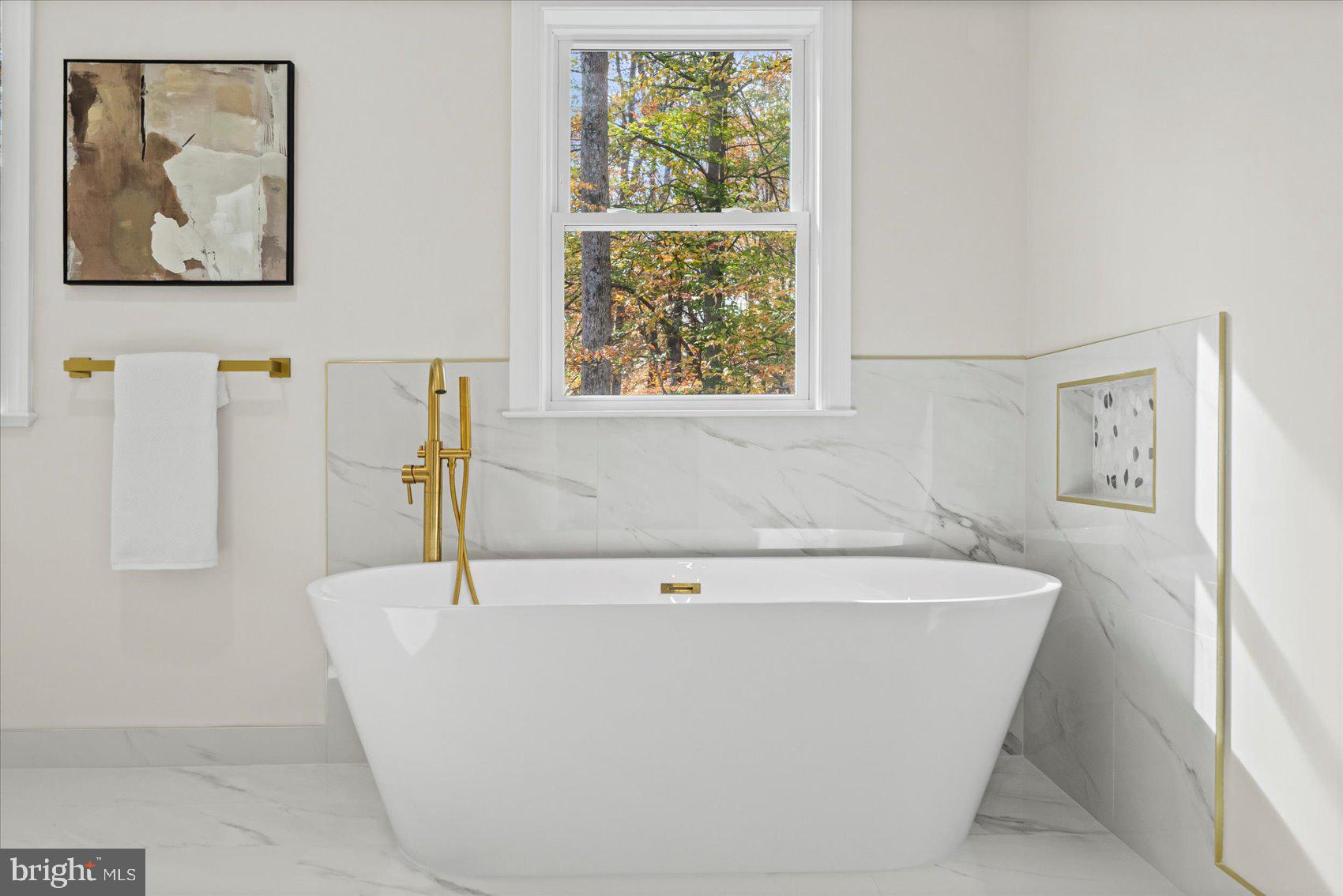 7604 Hackamore Drive Potomac, MD 20854 - Photo 68 of 81 a white bath tub sitting next to a window