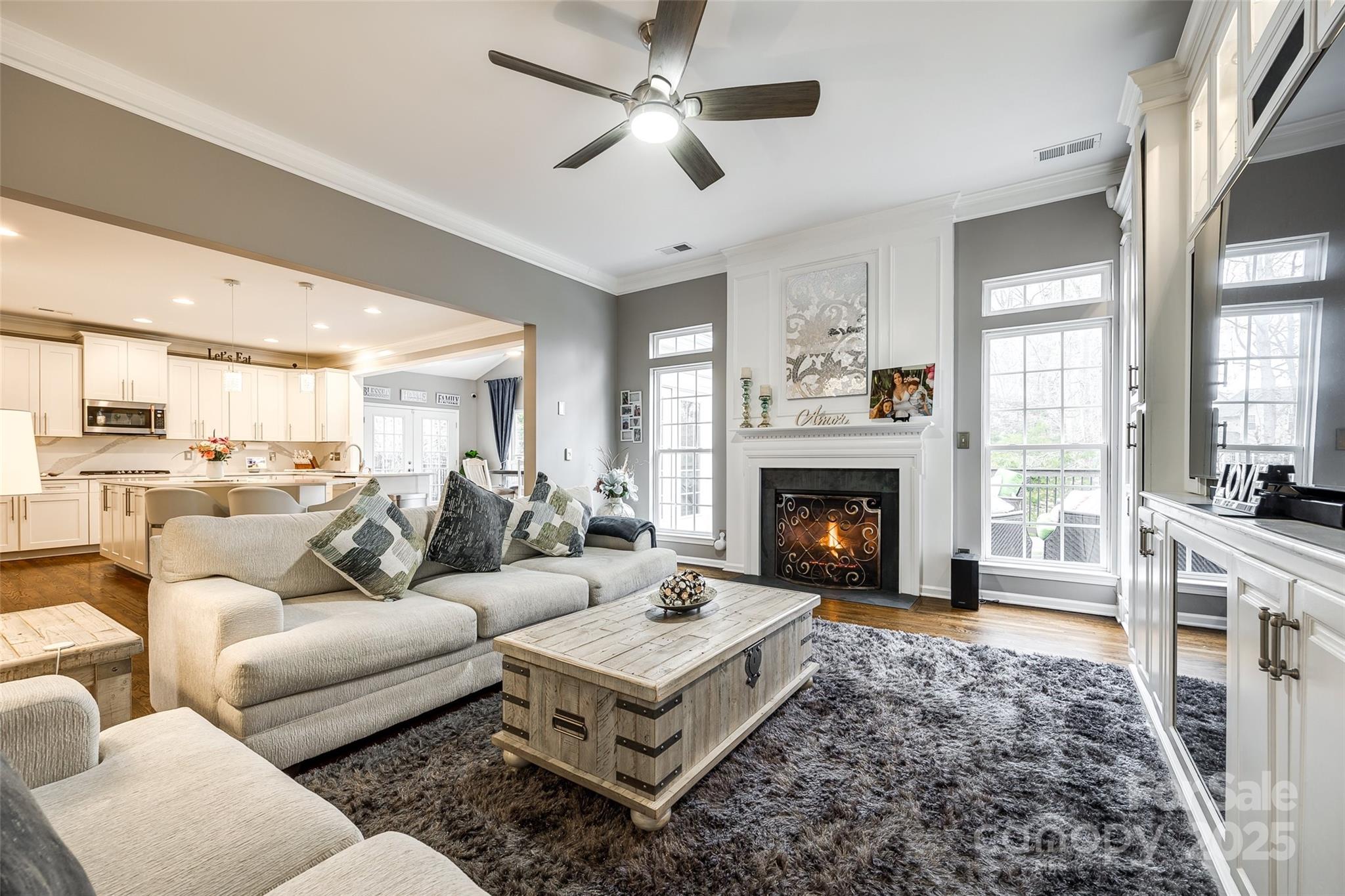 341 Fischer Road Fort Mill, SC 29715 - Photo 12 of 48 a living room with furniture fireplace and a large window